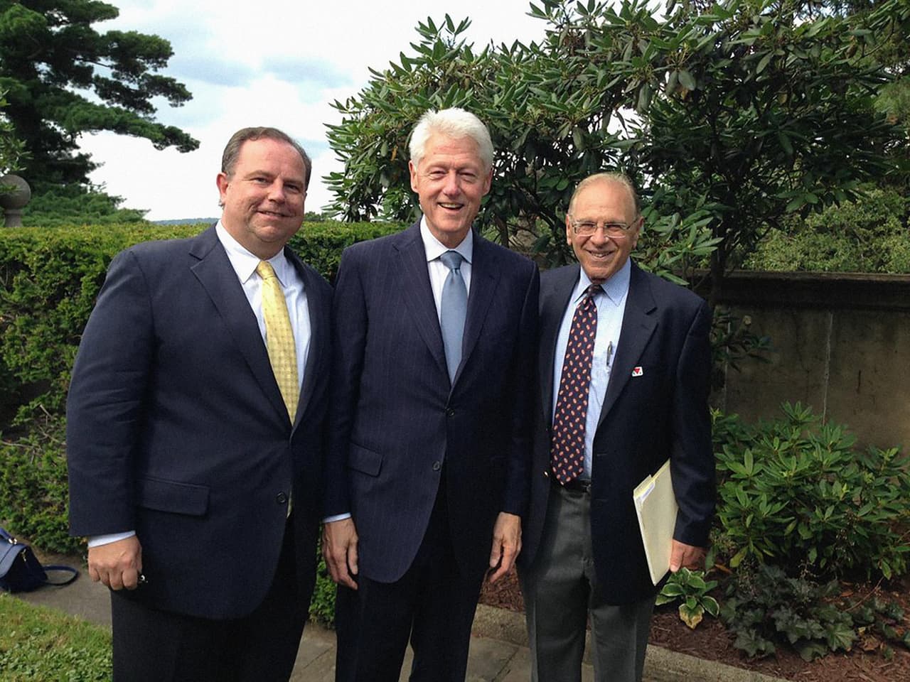 Christopher Ruddy, Bill Clinton and H. Yale Gutnick pose before Clinton's speech, Aug 2014 at a private memorial service in Pennsylvania for Richard Mellon Scaife. Clinton recalled how, after his presidency, he built a friendship with the conservative billionaire who was a former critic of the Clintons. Twitter: 
<a href="https://twitter.com/ChrisRuddyNMX">@<b>ChrisRuddyNMX</b></a>