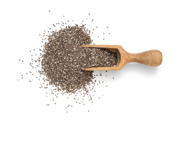 Chia seeds in scoop on white background