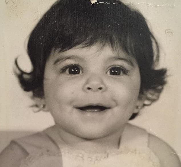 Esta risueña bebé nació en Santo Domingo, República Dominicana.