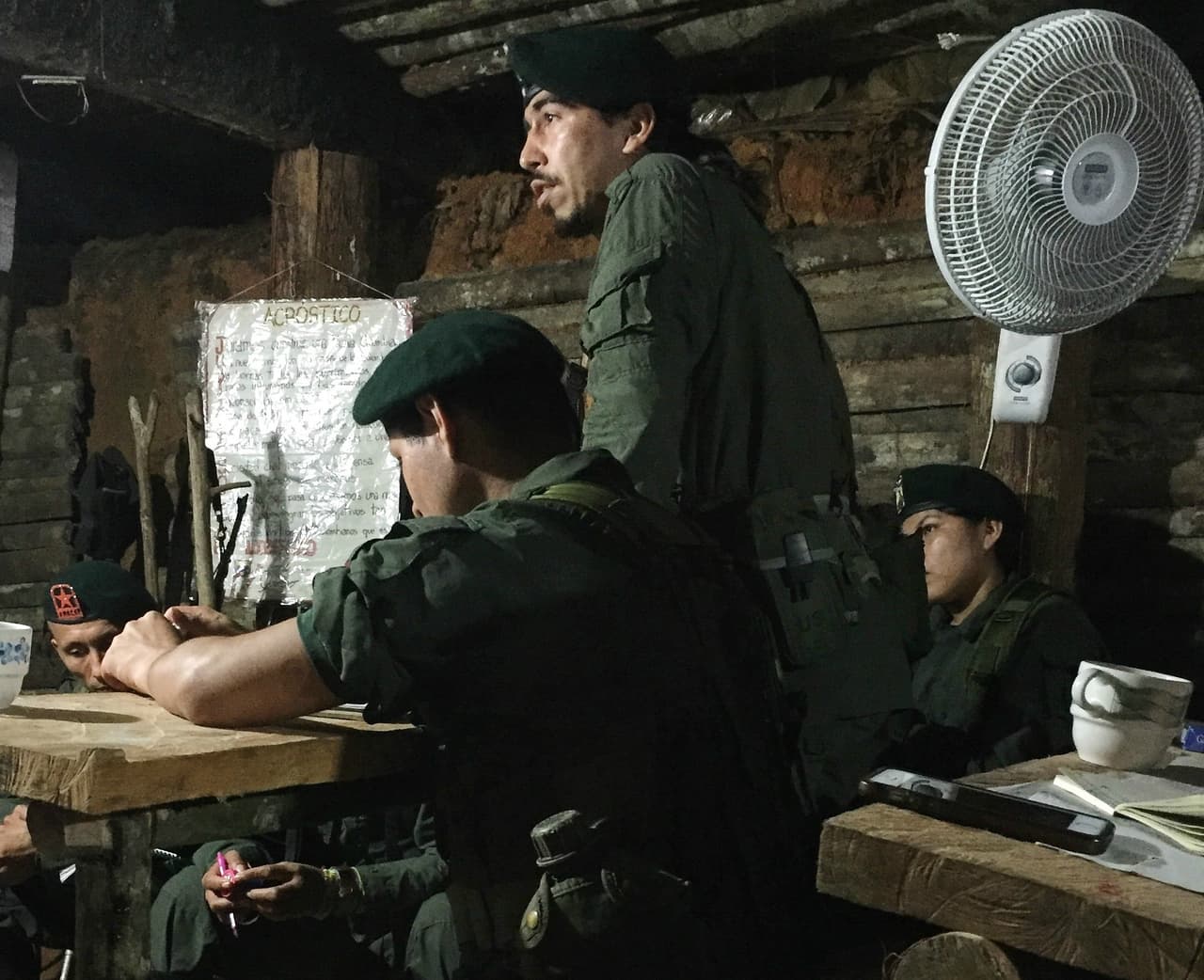 Efrain, a FARC fighter, speaks during a course on civilian life in an underground classroom at a camp in southern Colombia