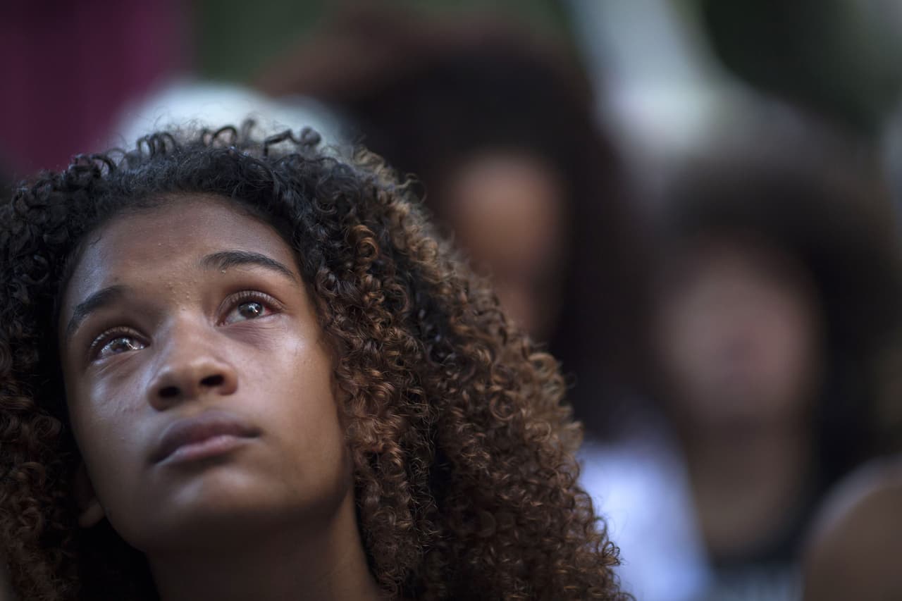 Protester crying in a demonstration against the murder of Brazilian councilwoman and activist Marielle Franco in front of Rio's Municipal Chamber, Rio de Janeiro, Brazil, on March 20, 2018. Brazilians mourned for the Rio de Janeiro councilwoman and outspoken critic of police brutality who was shot in the city center in an assassination-style killing on March 14. / AFP PHOTO / Mauro Pimentel (Photo credit should read MAURO PIMENTEL/AFP/Getty Images)