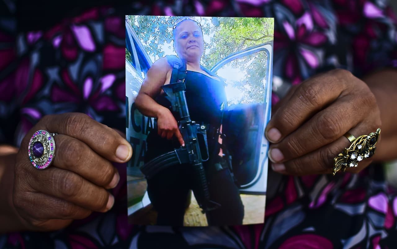 María Luisa Silva holds a picture of her daughter Gladys, a police officer who went missing in Ciudad Victoria, Tamaulipas, in 2014.