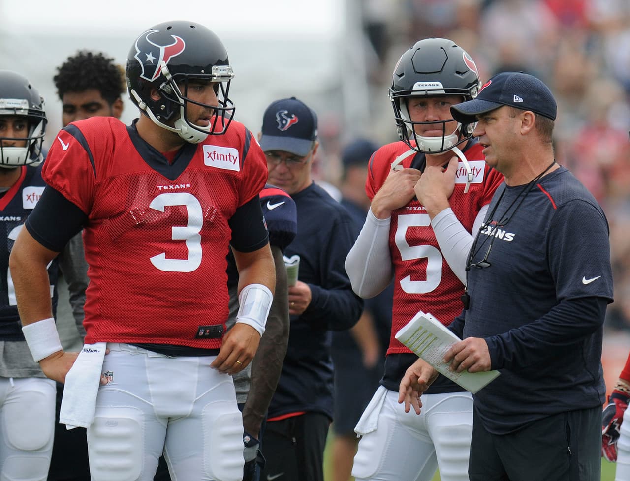 Houston Texans head coach Bill O'Brien, right, talks with quarterbacks Tom Savage (3) and Brandon Weeden (5) during a joint NFL football team practice with the New England Patriots in White Sulphur Springs, W.Va., Wednesday, Aug. 16, 2017. (AP Photo/Chris Jackson)