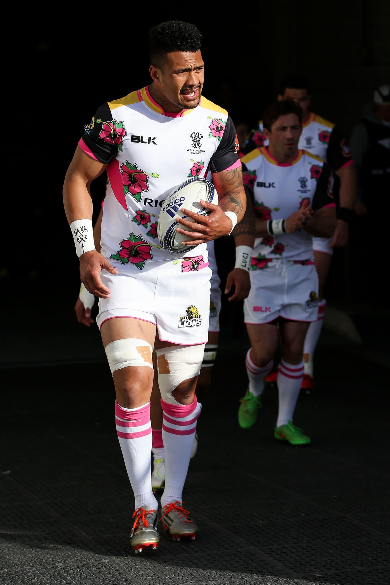 WELLINGTON, NEW ZEALAND - OCTOBER 10: Ardie Savea of Wellington leads his team out onto the field in a special strip designed by him in honour of his grandmother, who died from breast cancer in 2005, during the round nine ITM Cup match between Wellington and Manawatu at Westpac Stadium on October 10, 2015 in Wellington, New Zealand. (Photo by Hagen Hopkins/Getty Images)