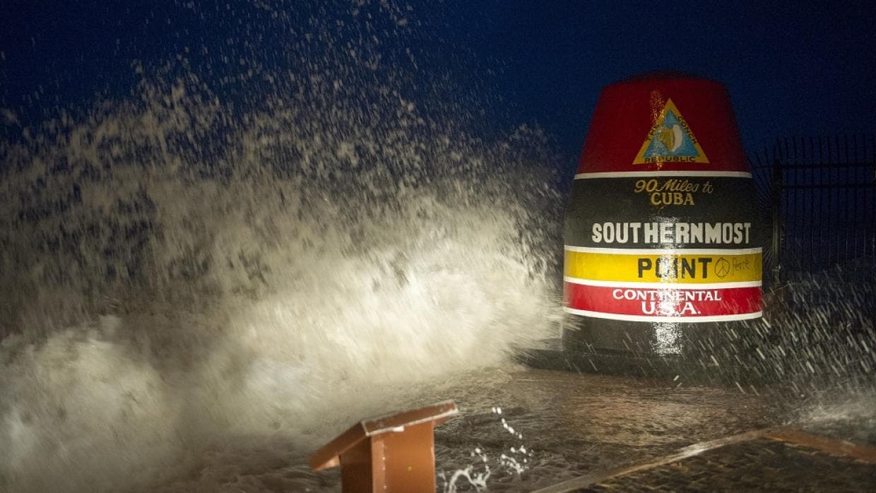 Waves smash into the marker at Key West's Southernmost Point of the United States