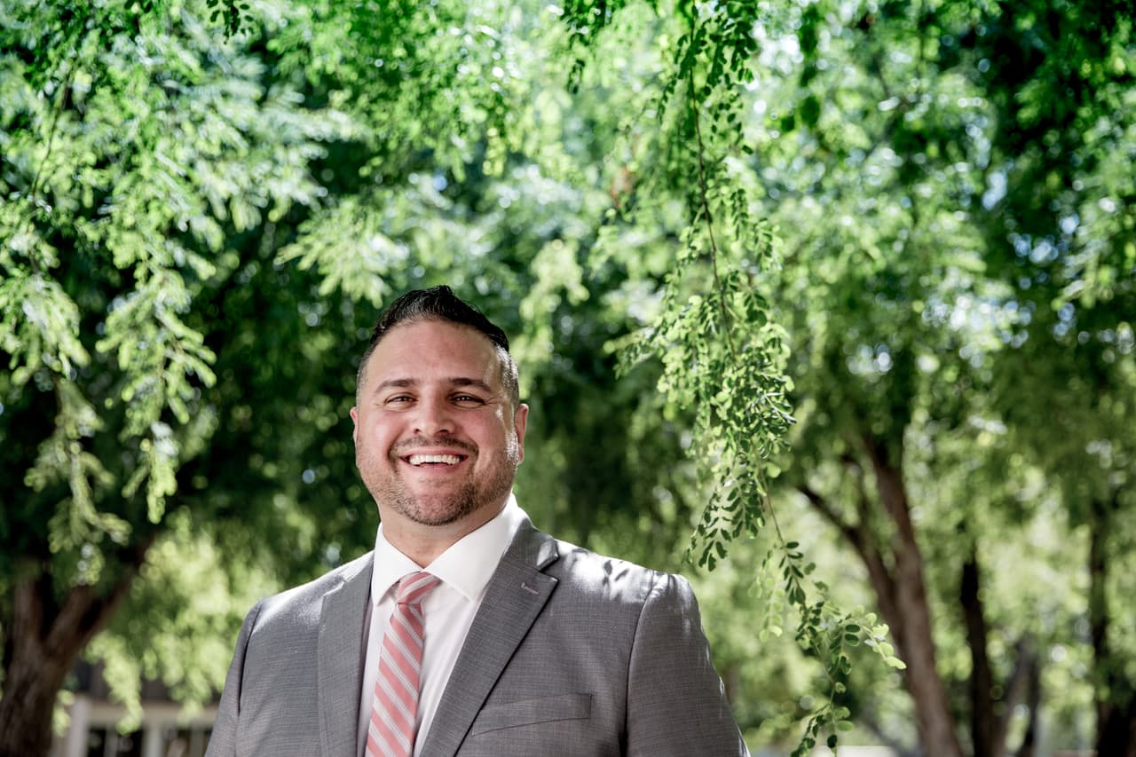 Ignacio Calderin in a park outside the Transition office where he works in Miami's Overturn neighborhood.