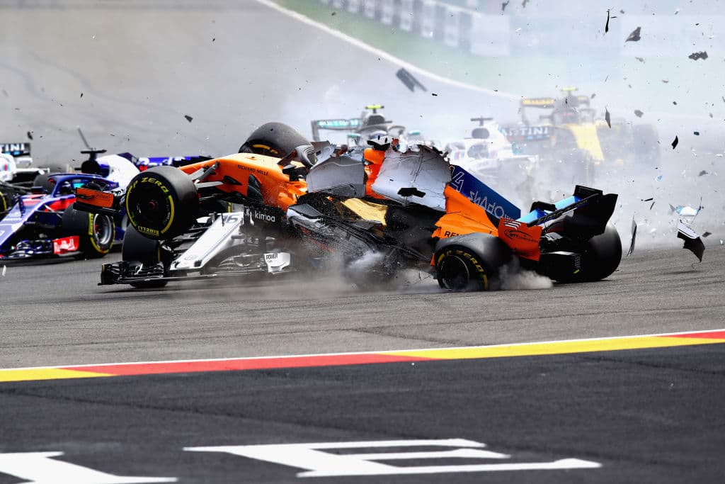 SPA, BELGIUM - AUGUST 26: Fernando Alonso of Spain driving the (14) McLaren F1 Team MCL33 Renault launches over the top of Charles Leclerc of Monaco driving the (16) Alfa Romeo Sauber F1 Team C37 Ferrari at the start during the Formula One Grand Prix of Belgium at Circuit de Spa-Francorchamps on August 26, 2018 in Spa, Belgium. (Photo by Mark Thompson/Getty Images)