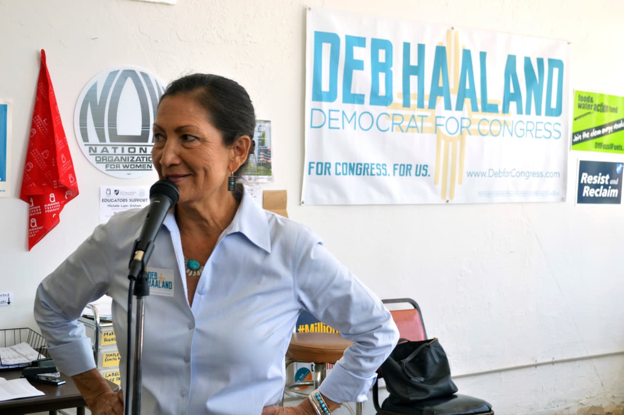 Debra Haaland, a Democratic candidate for Congress, talks to a supporters speak at her Albuquerque, N.M., headquarters on Monday, June 4, 2018, as volunteers seek last minute voters for the Democratic nomination for an open Congressional seat in central New Mexico. Voters in the state’s central and southern district will decide Tuesday which Democrats and Republicans will win their parties’ nominations for two open seats that could determine which parties control the U.S. House of Representatives. (AP Photo/Russell Contreras)