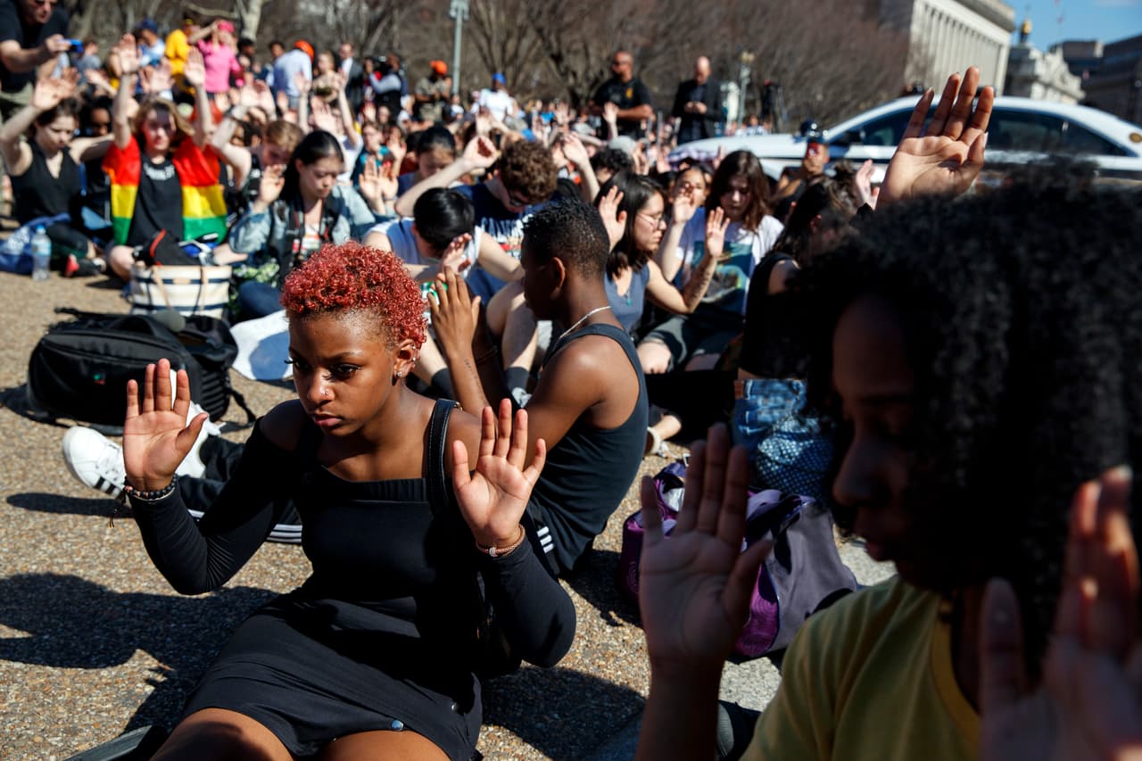 Lyndon Parrot, 17, of Silver Spring, Md., takes part in a moment of silence during a student protest for gun control legislation in front of the White House, Wednesday, Feb. 21, 2018, in Washington. (AP Photo/Evan Vucci)