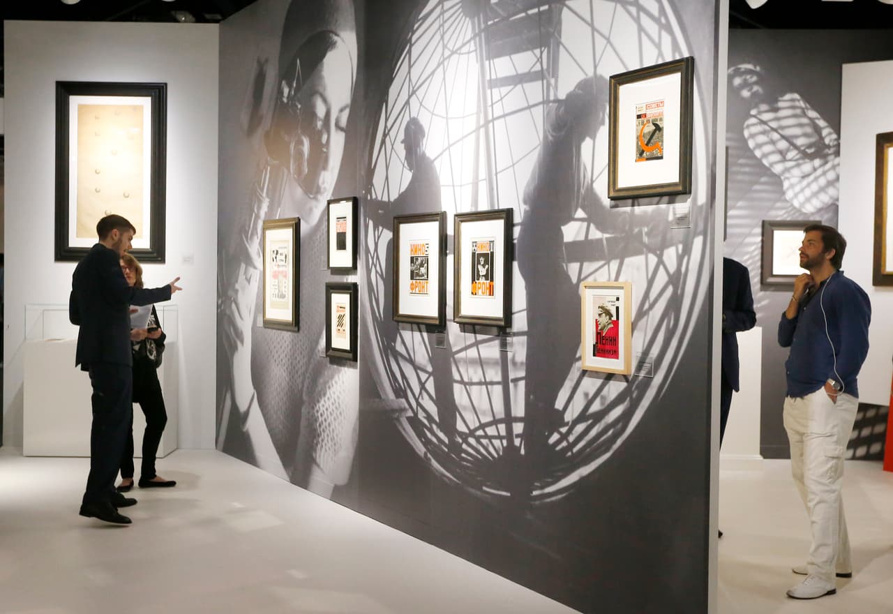 Art patrons walk through a gallery during Art Basel in Miami on November 30, 2016. Art Basel represents over 250 art galleries at the Miami Beach Convention Center and is considered one of the world's largest art festivals with art events throughout the city. / AFP / RHONA WISE / RESTRICTED TO EDITORIAL USE - MANDATORY MENTION OF THE ARTIST UPON PUBLICATION - TO ILLUSTRATE THE EVENT AS SPECIFIED IN THE CAPTION (Photo credit should read RHONA WISE/AFP/Getty Images)