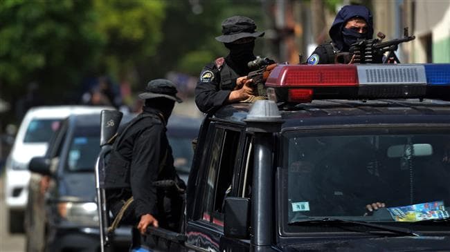 Nicaragua's special operations police patrol the Monimbo neighborhood, one with a Dragunov, in the city of Masaya after clashes with anti-government demonstrations, on July 18, 2018.