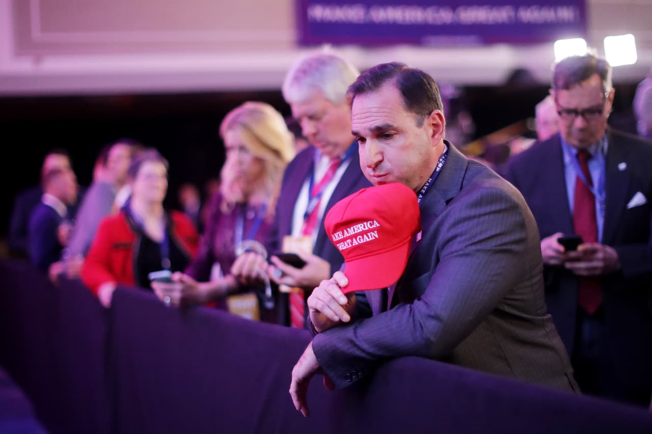 NEW YORK, NY - NOVEMBER 08: A supporter of Republican presidential nominee Donald Trump watches early results during the election night event at the New York Hilton Midtown on November 8, 2016 in New York City. Americans today will choose between Republican presidential nominee Donald Trump and Democratic presidential nominee Hillary Clinton as they go to the polls to vote for the next president of the United States. (Photo by Chip Somodevilla/Getty Images)