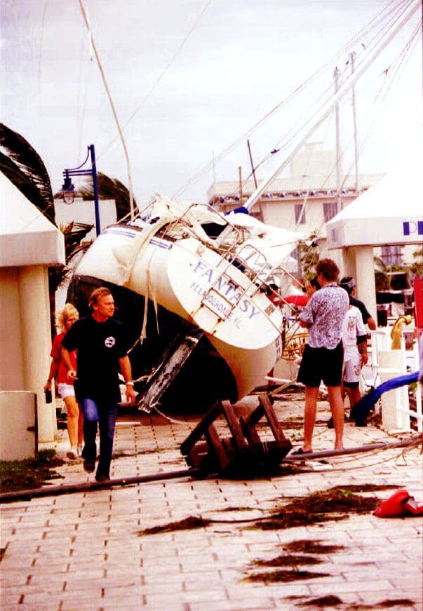 Onlookers observe the damage after Andrew.