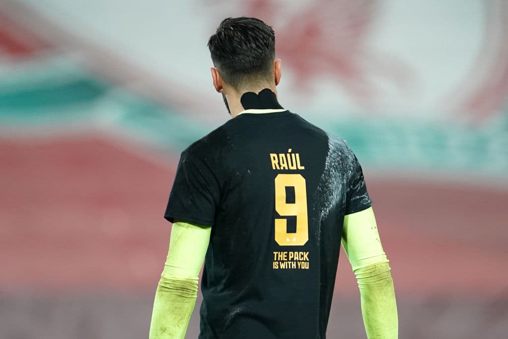 LIVERPOOL, ENGLAND - DECEMBER 06: Rui Patricio of Wolverhampton Wanderers wears a number nine shirt in support for injured team mate Raul Jimenez (Not pictured) of Wolverhampton Wanderers during the warm up ahead of the Premier League match between Liverpool and Wolverhampton Wanderers at Anfield on December 06, 2020 in Liverpool, England. A limited number of fans (2000) are welcomed back to stadiums to watch elite football across England. This was following easing of restrictions on spectators in tiers one and two areas only. (Photo by Jon Super - Pool/Getty Images)