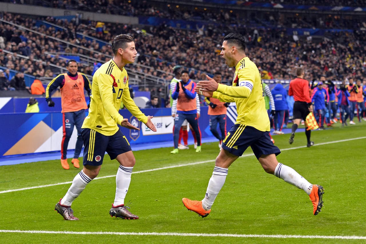 PARIS, FRANCE - MARCH 23: Radamel Falcao of Colombia is congratulated by teammate James Rodriguez after scoring during the international friendly match between France and Colombia at Stade de France on March 23, 2018 in Paris, France. (Photo by Aurelien Meunier/Getty Images)