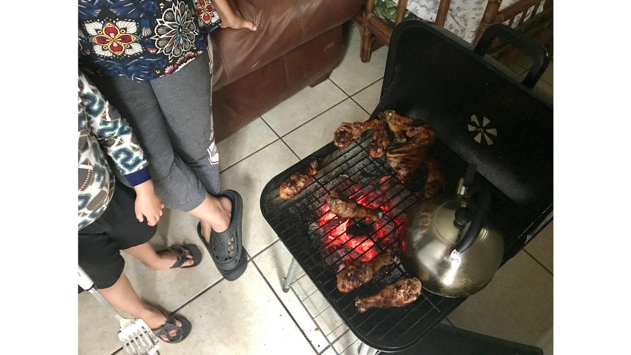 Lisette and her daughter, both undocumented, make chicken wings.