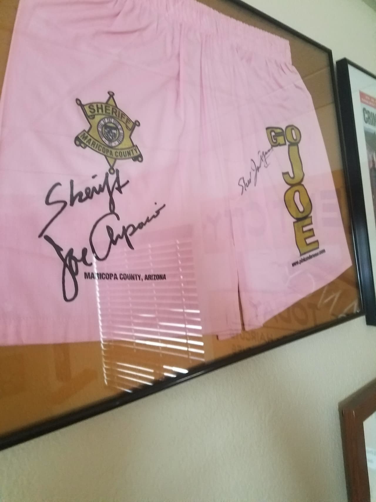 In his office, Arpaio has career memorabilia such as this autographed pink underwear that his inmates were forced to wear.
