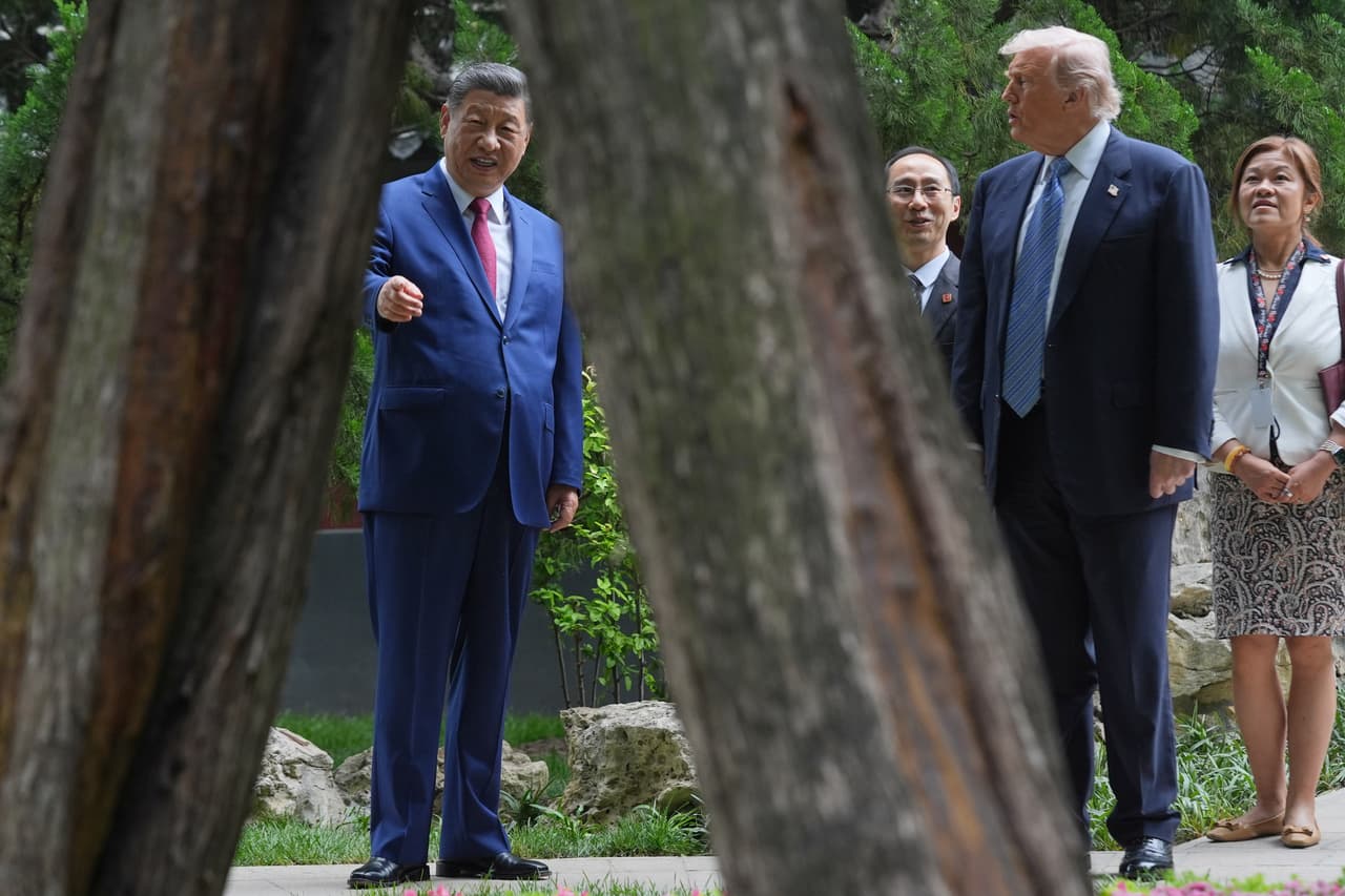 President Donald Trump talks with China's President Xi Jinping at the Zhongnanhai leadership compound, Friday, May 15, 2026, in Beijing. (AP Photo/Mark Schiefelbein, Pool)