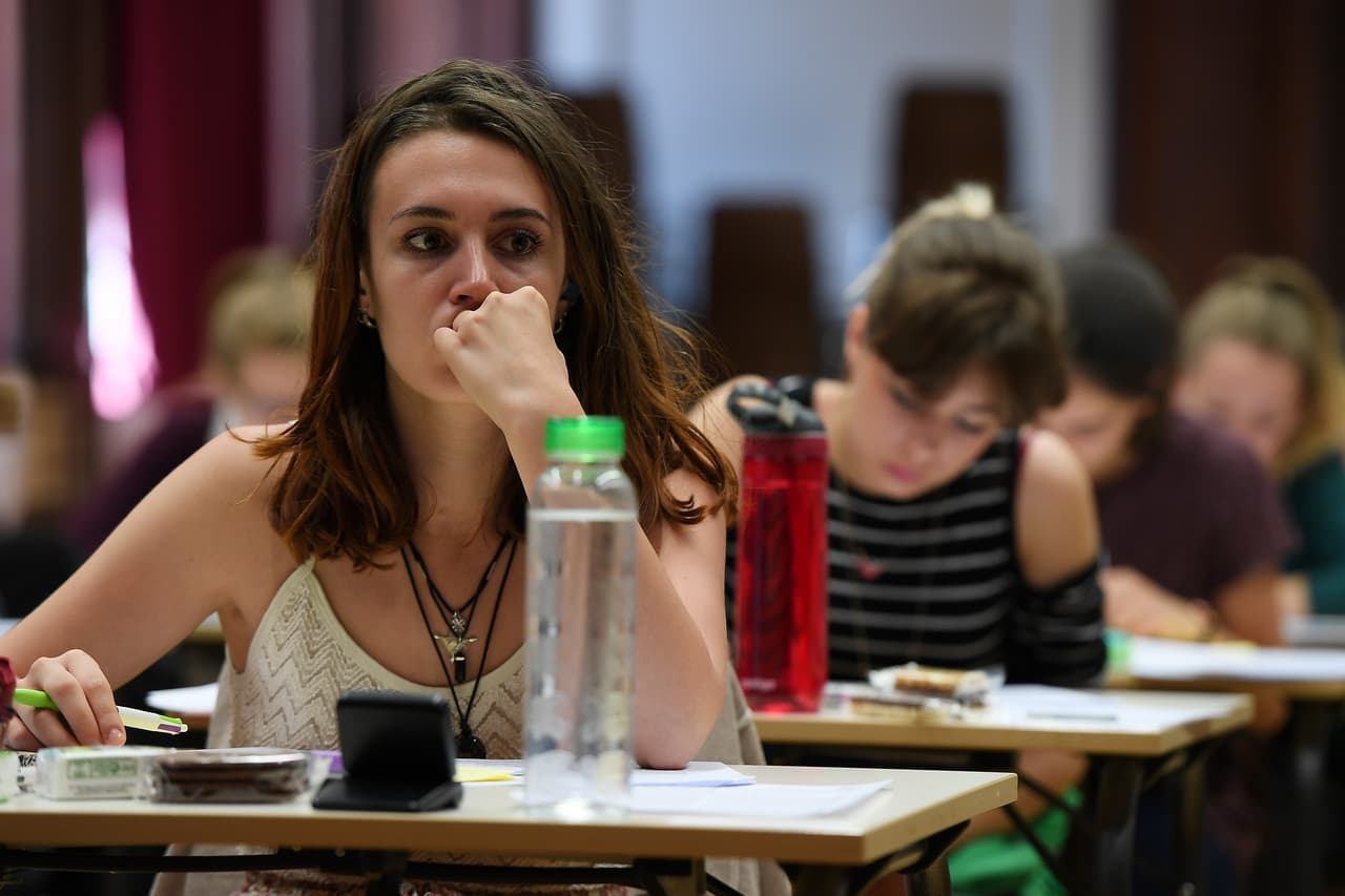 High school students take the philosophy exam, the first test session of the 2017 baccalaureate (high school graduation exam) on June 15, 2017 at the Fustel de Coulanges high school in Strasbourg, eastern France. A total of 520.000 Students of general and technological graduating classes are registered to take their written baccalaureat exams at over 4 400 examination centres across France between June 15-June 22, 2017. / AFP PHOTO / FREDERICK FLORIN (Photo credit should read FREDERICK FLORIN/AFP/Getty Images)
