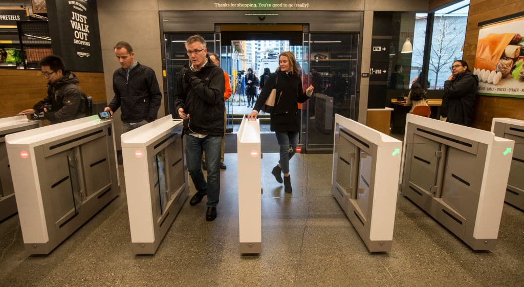 SEATTLE, WA - JANUARY 22: Shoppers scan the Amazon Go app on the mobile devices as the enter the Amazon Go store, on January 22, 2018 in Seattle, Washington. After more than a year in beta Amazon opened the cashier-less store to the public. (Photo by Stephen Brashear/Getty Images)