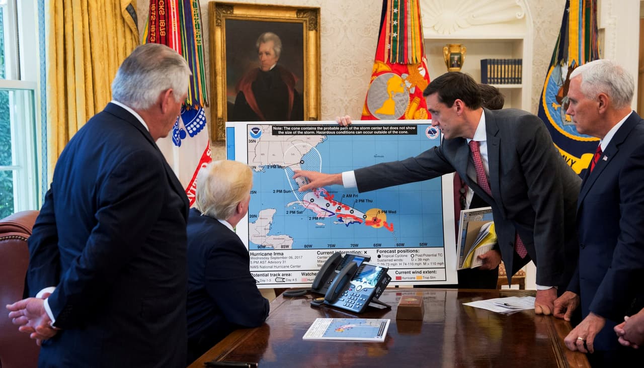 U.S. President Donald Trump is seen in an official White House handout photo with U.S. Secretary of State Rex Tillerson (L), Homeland Security and Counterterrorism Adviser Thomas Bossert (2ndR) and Vice President Mike Pence (R) as he participates in an Oval Office briefing tracking the approach of Hurricane Irma toward the coast of Florida, at the White House in Washington, U.S., September 7, 2017. Picture taken September 7, 2017. Andrea Hanks/Courtesy of the White House/Handout via REUTERS ATTENTION EDITORS - THIS PICTURE WAS PROVIDED BY A THIRD PARTY?