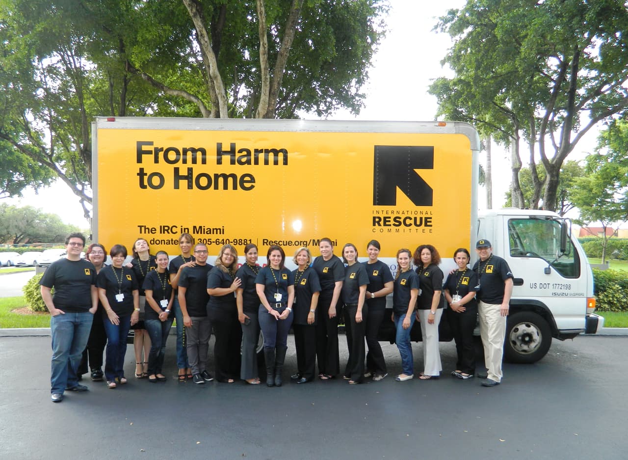 The International Rescue Committee (IRC) is one of nine organizations that resettle refugees in the United States. It is closing three of its offices in Midland, Texas, Garden City, Kansas and Miami, Florida. Photo is of IRC Miami staff.