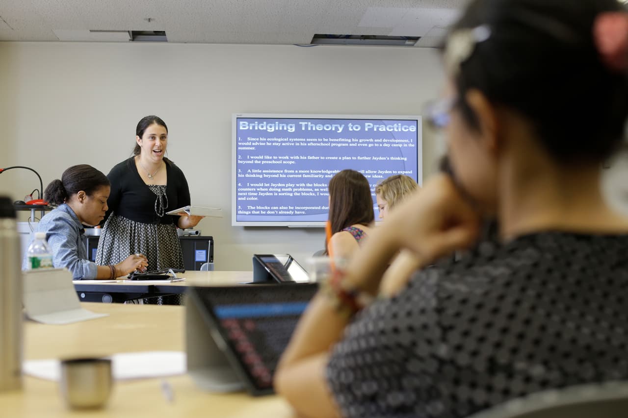 FILE- In this Wednesday, June 25, 2014 file photo, Dr. Lindsay Portnoy leads a class in early childhood development at Hunter College in New York, as part of a push to expand pre-K under the program championed by New York City Mayor Bill de Blasio.The city hired and trained 1,000 new teachers to staff its pre-K classrooms in 2014 and plans to bring aboard another 1,000 for 2015, when the program reaches full capacity (AP Photo/Frank Franklin, File)