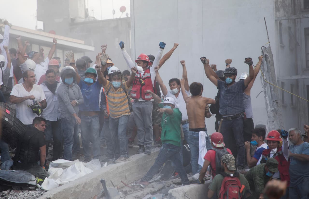 The request for silence is made at a collapsed building, where experts try to communicate with possible survivors. 
<br>