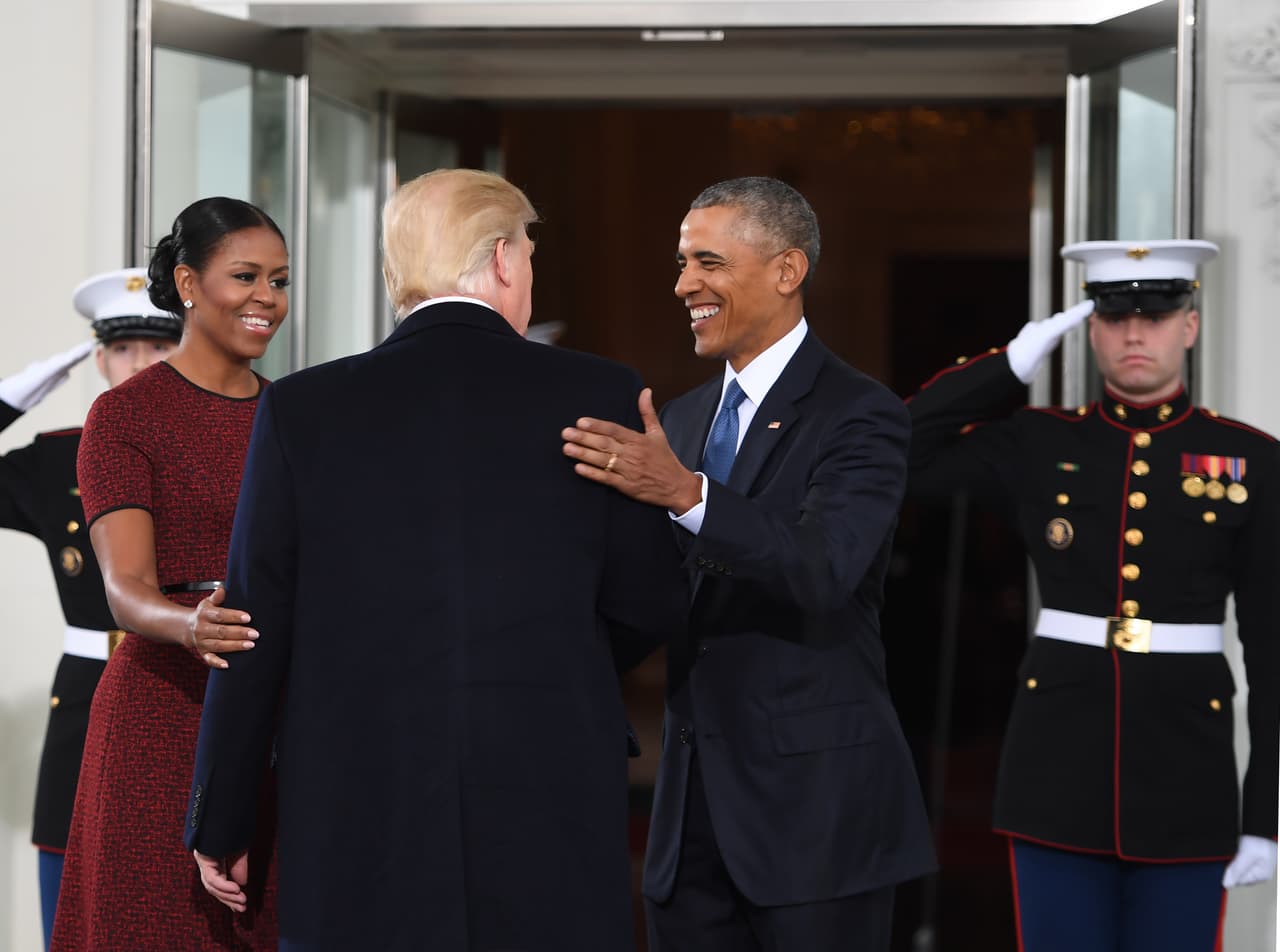 President-elect Donald Trump(C)is greeted by US President Barack Obama and First Lady Michelle Obama(L) as he arrives at the White House in Washington, DC January 20, 2017. / AFP / JIM WATSON (Photo credit should read JIM WATSON/AFP/Getty Images)