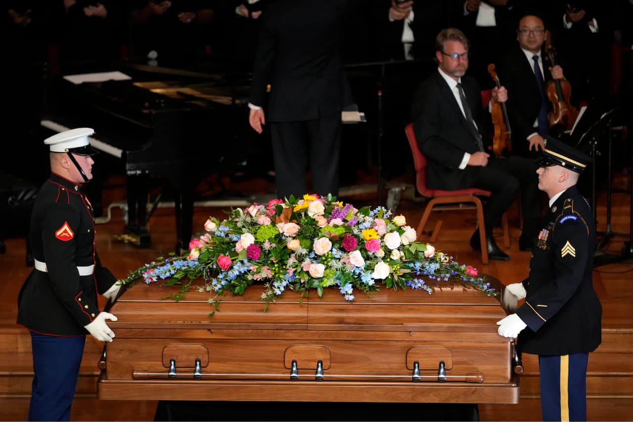 The casket of former first lady Rosalynn Carter, arrives inside Glenn Memorial Church, Tuesday, Nov. 28, 2023, in Atlanta. (AP Photo/Andrew Harnik)