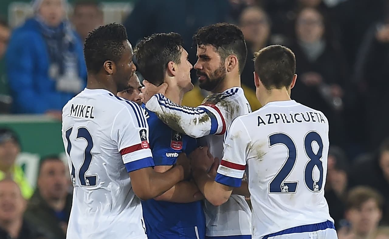 Chelsea's Brazilian-born Spanish striker Diego Costa (2nd R) and Everton's English midfielder Gareth Barry clash in the incident leading to Costa's second yellow card during the English FA cup quarter-final football match between Everton and Chelsea at Goodison Park in Liverpool, north west England on March 12, 2016. / AFP / Paul ELLIS / RESTRICTED TO EDITORIAL USE. No use with unauthorized audio, video, data, fixture lists, club/league logos or 'live' services. Online in-match use limited to 75 images, no video emulation. No use in betting, games or single club/league/player publications. / (Photo credit should read PAUL ELLIS/AFP/Getty Images)