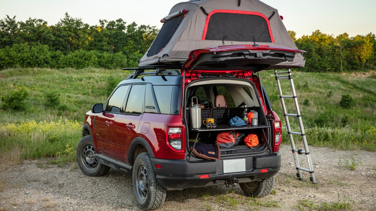 Bronco Sport can quickly help with basecamp setup thanks to an innovative slide-out working table, part of the available five-way configurable Cargo Management System. (Pre-production model pictured.)