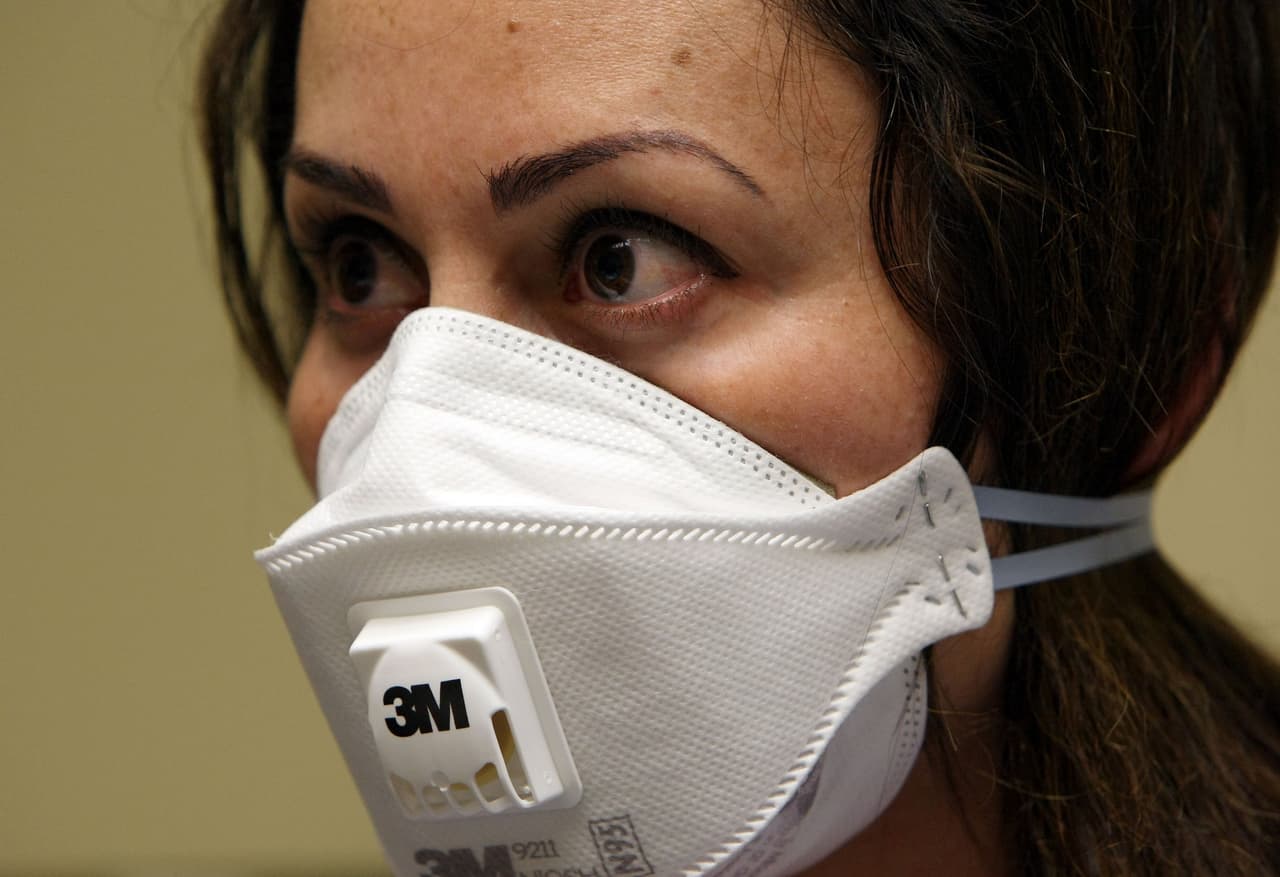 OAKLAND, CA - APRIL 28: A nurse at the La Clinica San Antonio Neighborhood Health Center wears a N95 respiratory mask during a training session April 28, 2009 in Oakland, California. As the number of swine flu cases in the U.S. continues to rise, doctors and nurses at La Clinica's 26 facilities are being trained to use the N95 respiratory mask to be worn if they come in contact with a patient wo is suspected of having the swine flu or tuberculosis. (Photo by Justin Sullivan/Getty Images)