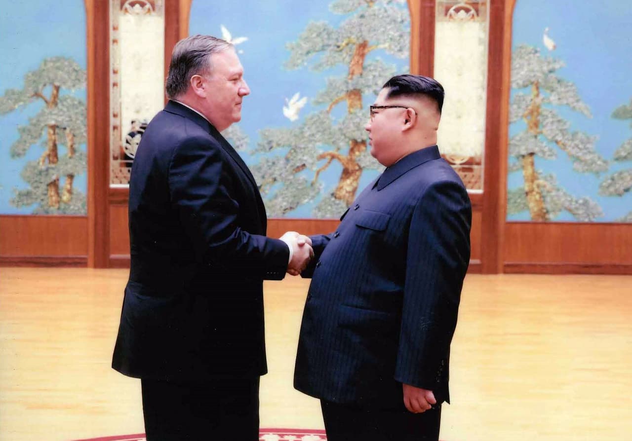 PYONGYANG, NORTH KOREA - UNDATED: In this handout provided by The White House, CIA director Mike Pompeo (L) shakes hands with North Korean leader Kim Jong Un in this undated image in Pyongyang, North Korea. Pompeo, now confirmed as Secretary of State, spoke with Kim for more than an hour during a secret visit over the Easter weekend. (Photo by The White House via Getty Images)