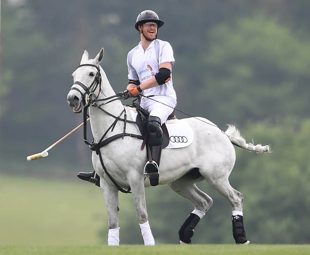 Photo © 2017 Mega/The Grosby Group Ascot, May 06, 2017. Meghan Markle watches Prince Harry play polo, with Prince Harry's mentor Mark Dyer and wife Amanda, in the Audi Polo Challenge at Coworth Park Polo Club on May 6, 2017 in Ascot, England. Mark at one point went and got her jacket.