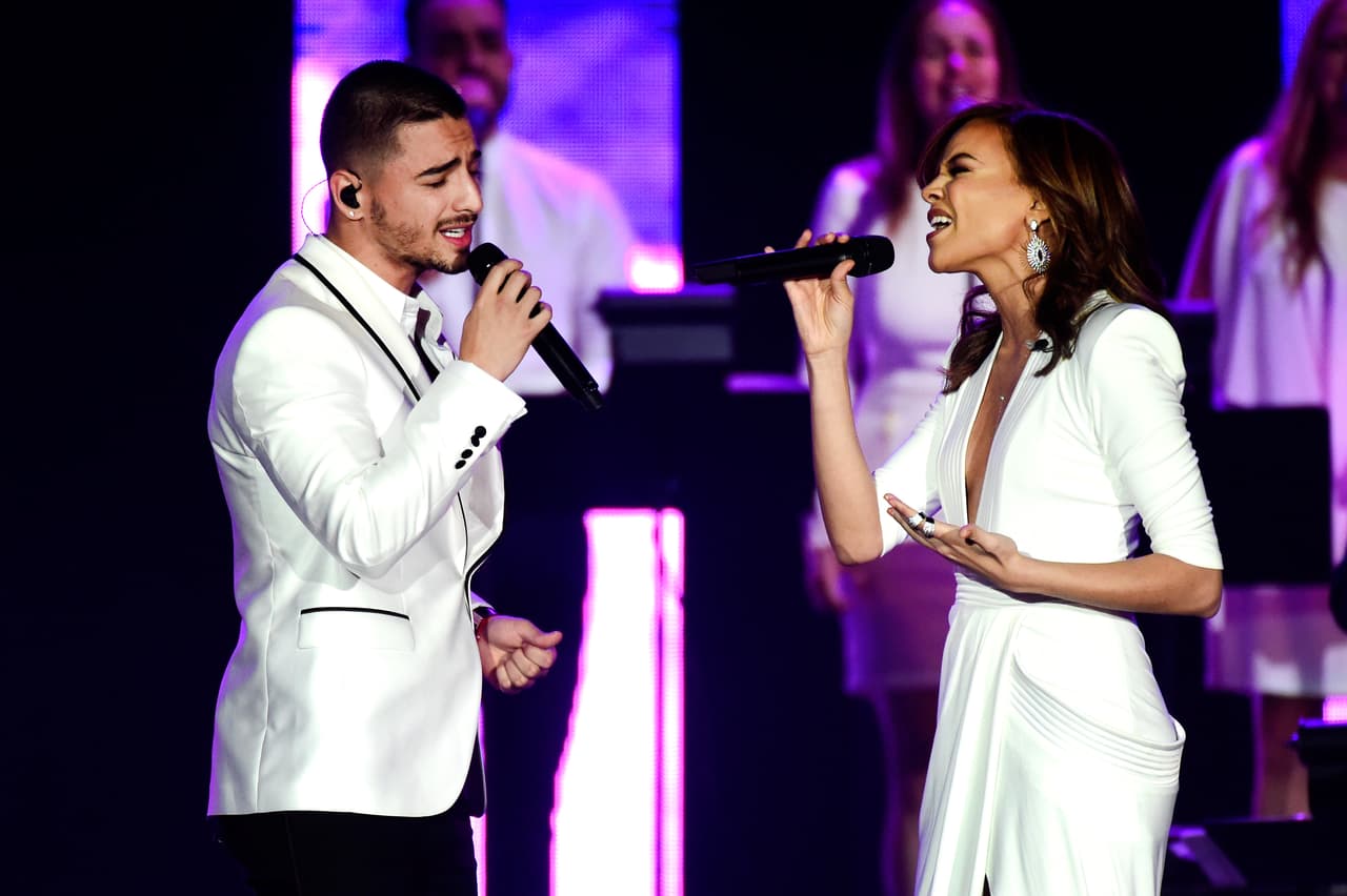 <b>Dónde estás - Maluma (2015)</b>
<br>"Dónde estás 
<br>Que mientras más te busco 
<br>Menos te encuentro-oh-oh-oh 
<br>Woh oh oh oh"