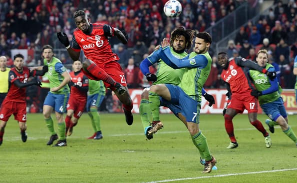 TORONTO, ON - DECEMBER, 9 In first half action, Toronto FC defender Chris Mavinga (23) puts the ball towards the net around a lot of traffic. The TFC (Toronto Football Club) took on the Seattle Sounders in the MLS Cup Final at BMO field in Toronto. It is the second year in a row the two faced off in the final. Soccer, pitch, ball, championship, players, team sport December, 9 2017 (Richard Lautens/Toronto Star via Getty Images)