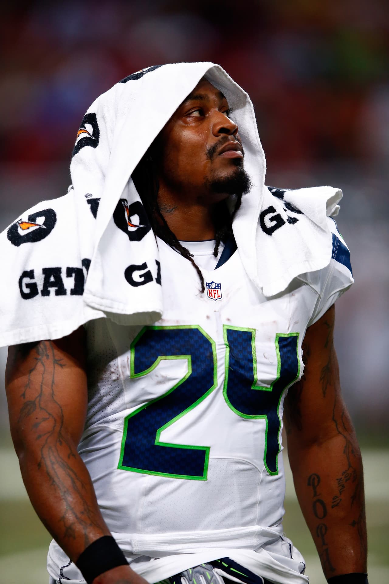 ST LOUIS, MO - SEPTEMBER 13: Running back Marshawn Lynch #24 of the Seattle Seahawks watches from the bench during the game against the Seattle Seahawks at Edward Jones Dome on September 13, 2015 in St Louis, Missouri. (Photo by Jamie Squire/Getty Images)