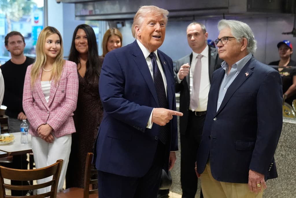 President Donald Trump talks with owner max Alvarez as he visits Venezuelan restaurant El Arepazo, Monday, March 9, 2026, in Doral, Fla. (AP Photo/Mark Schiefelbein)
