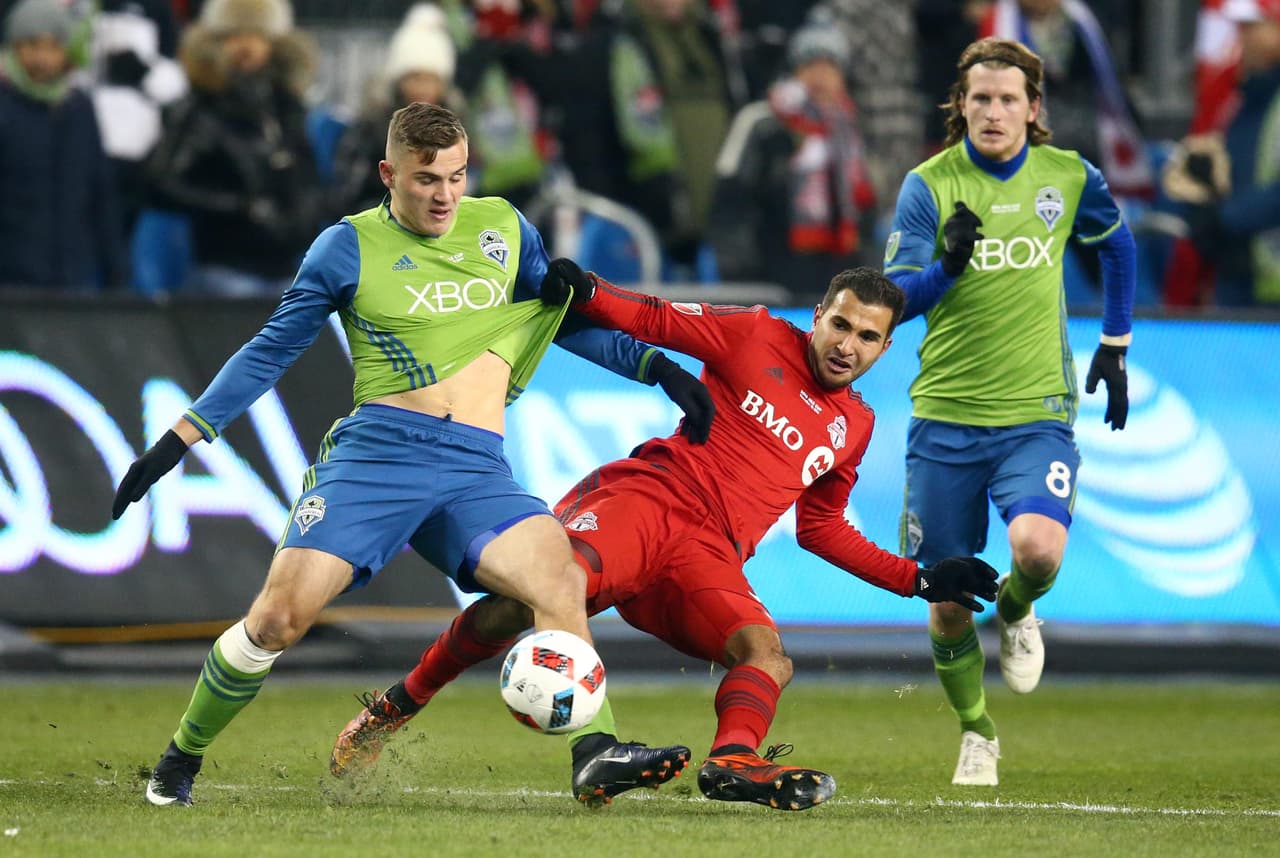 Dec 10, 2016; Toronto, Canada; Toronto FC defender Steven Beitashour (33) kicks the ball against Seattle Sounders forward Jordan Morris (13) during the first half in the 2016 MLS Cup at BMO Field. Mandatory Credit: Mark J. Rebilas-USA TODAY Sports
