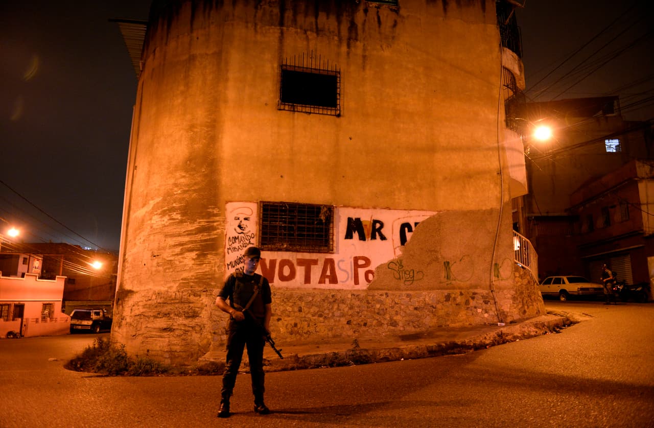 A member of the National Guard takes part in a security operation in the impoverished Petare neighborhood, one of Caracas' most dangerous slums, on May 13, 2013.