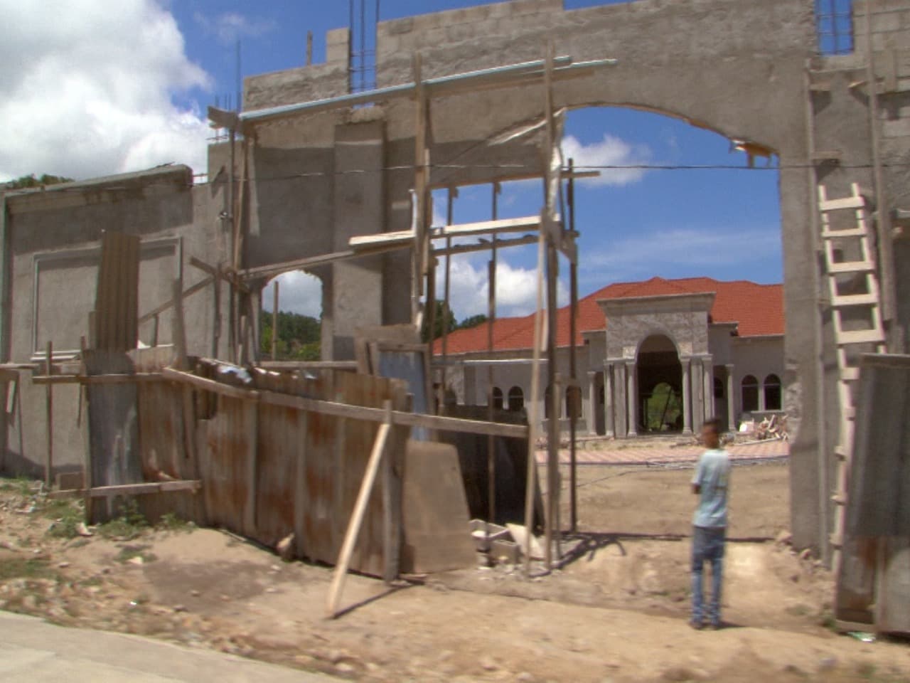 On the outskirts of Gracias, several modern, luxury residences are under construction that stand out in sharp contrast to the traditional, modest single-story homes in the town.