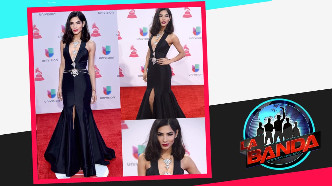 Para conducir la alfombra roja lució un vestido negro escotado también una creación de Michael Costello.