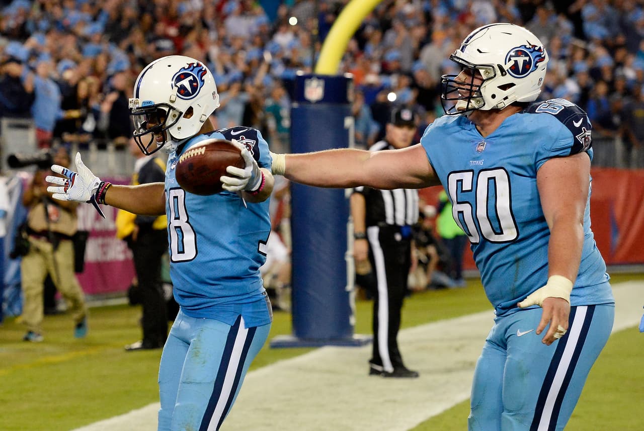 Tennessee Titans wide receiver Rishard Matthews (18) is congratulated by center Ben Jones (60) after Matthews scored a touchdown on a 4-yard pass play against the Jacksonville Jaguars in the second half of an NFL football game Thursday, Oct. 27, 2016, in Nashville, Tenn. (AP Photo/Mark Zaleski)