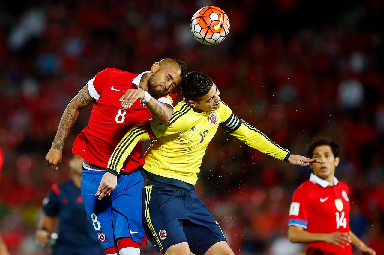 SANTIAGO, CHILE - NOVEMBER 12: Arturo Vidal of Chile fights for the ball with James Rodriguez of Colombia during a match between Chile and Colombia as a part of FIFA 2018 World Cup Qualifier at Nacional Julio Martinez Pradanos Stadium on November 12, 2015, in Santiago, Chile. (Photo by Franco Moreno/LatinContent/Getty Images)