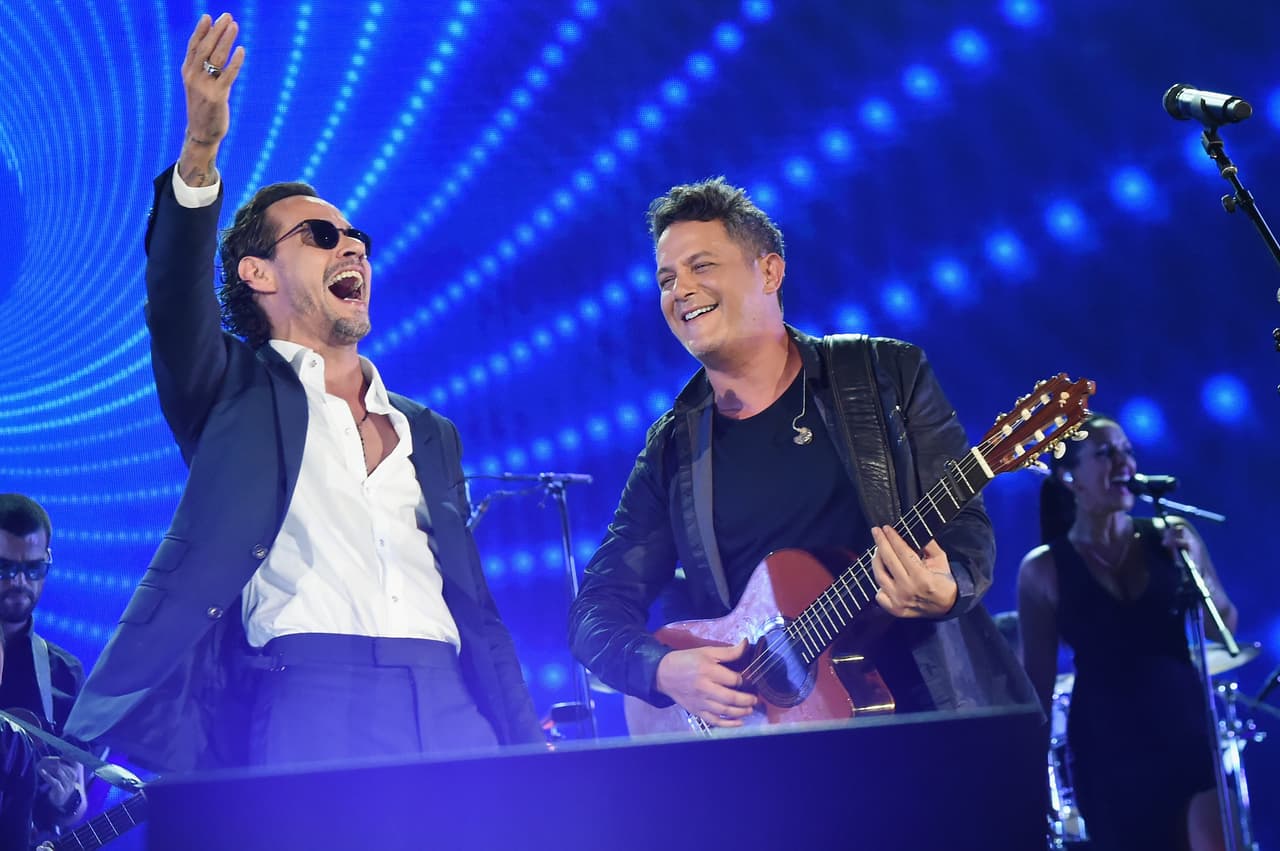 MIAMI, FL - OCTOBER 14: In this handout photo provided by One Voice: Somos Live!, Marc Anthony and Alejandro Sanz perform onstage at One Voice: Somos Live! A Concert For Disaster Relief at Marlins Park on October 14, 2017 in Miami, Florida. (Photo by Rick Diamond/One Voice: Somos Live!/Getty Images)