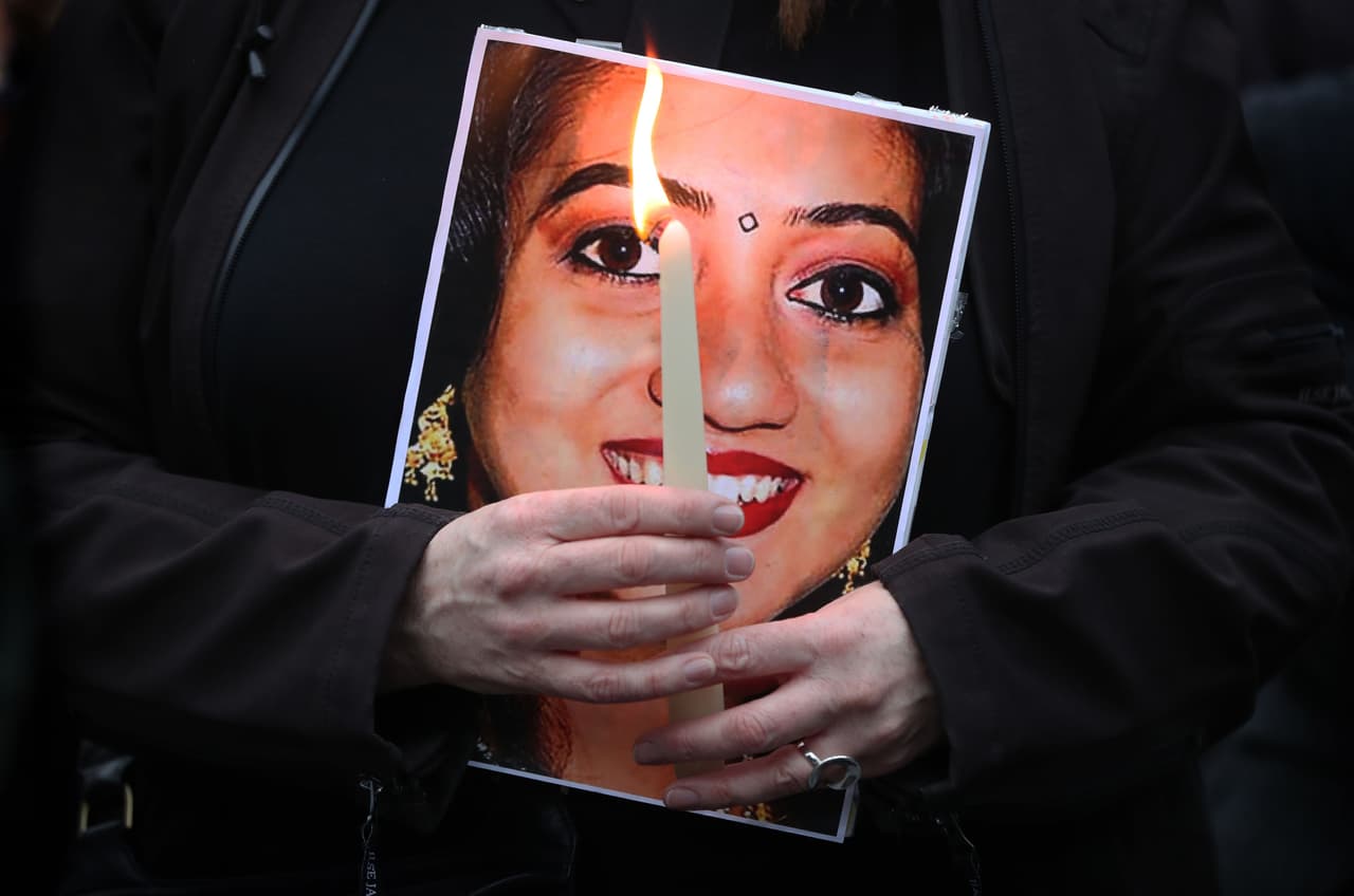 A person holds a candle as the coalition to repeal the Eighth Amendment hold a vigil to mark the fifth anniversary of the death of Savita Halappanavar, who died after she was denied a medically recommended abortion following a miscarriage, at the GPO on Dublin's O'Connell Street. (Photo by Niall Carson/PA Images via Getty Images)