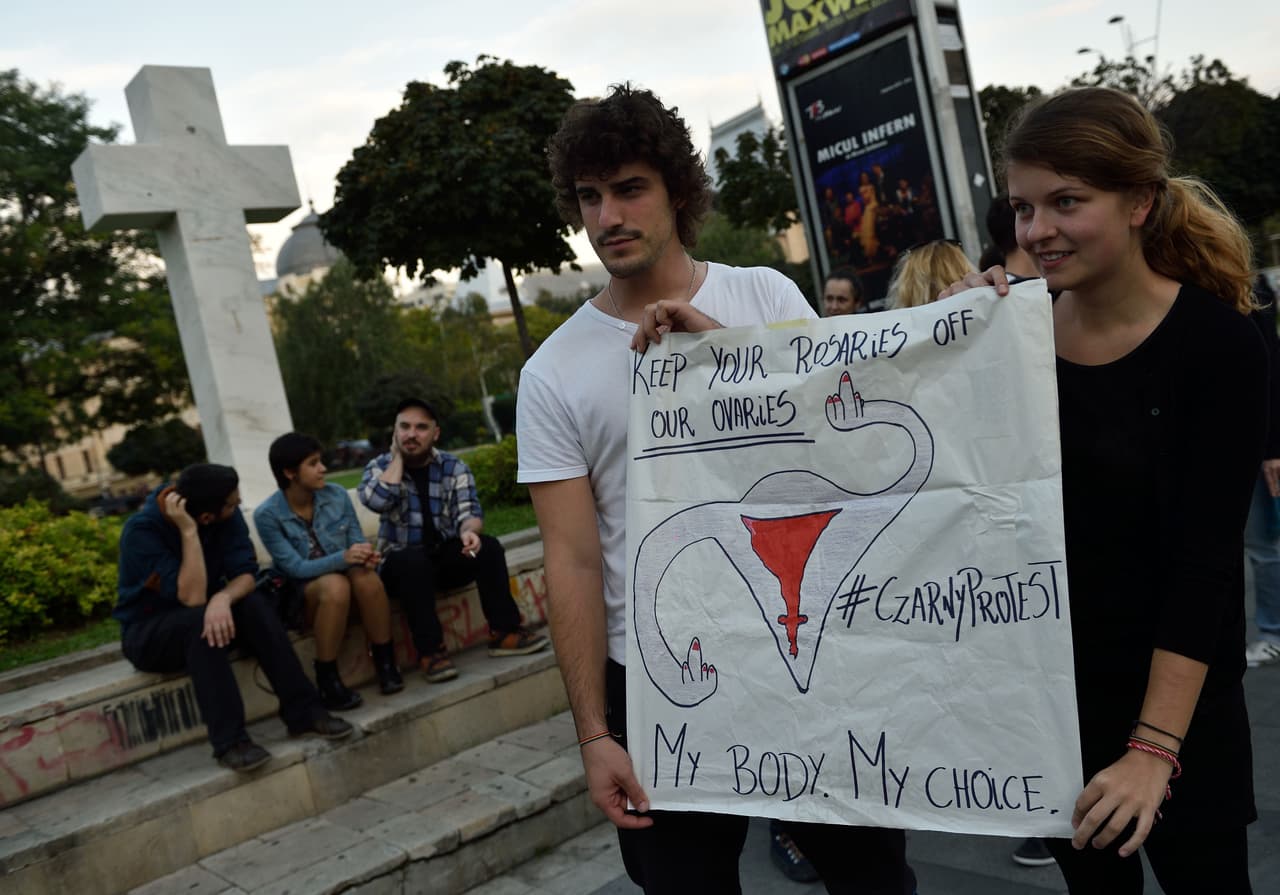 Romanians show support with Polish women on strike during a flashmob in Piata Universitatii square in Bucharest on October 3, 2016. Thousands of women dressed in black protested across Poland in the "Women strike" campaign against a proposed near-total abortion ban in the devoutly Catholic country where legislation is already among the most restrictive in Europe. / AFP / DANIEL MIHAILESCU (Photo credit should read DANIEL MIHAILESCU/AFP/Getty Images)