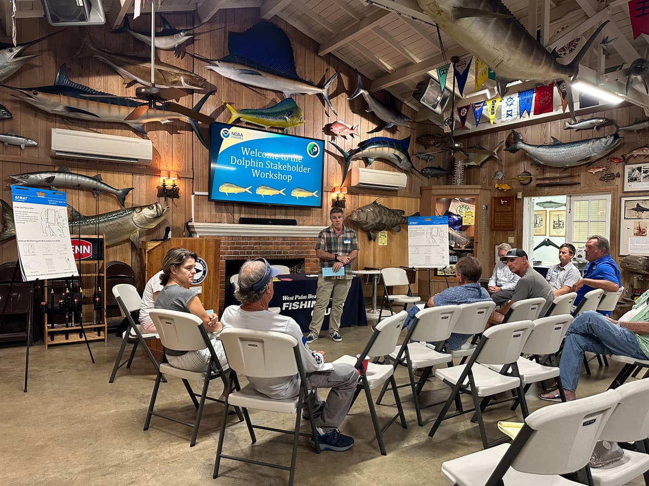Scientists from NOAA and the South Atlantic Fishery Management Council (SAFMC) listen as local fishermen discuss their preferences for the dolphinfish fishery at the West Palm Beach Fishing Club on October 4, 2022.