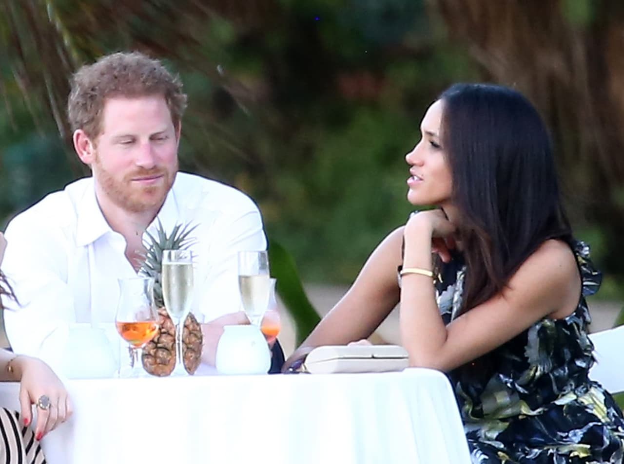 Photo © 2017 Fame Flynet USA/The Grosby Group PREMIUM EXCLUSIVE Jamaica, March 03, 2017 Royal couple Prince Harry and his girlfriend Meghan Markle were spotted attending a friend's wedding. Harry and Meghan enjoyed the festivities with the whole group before breaking off for some private conversation at a small table.